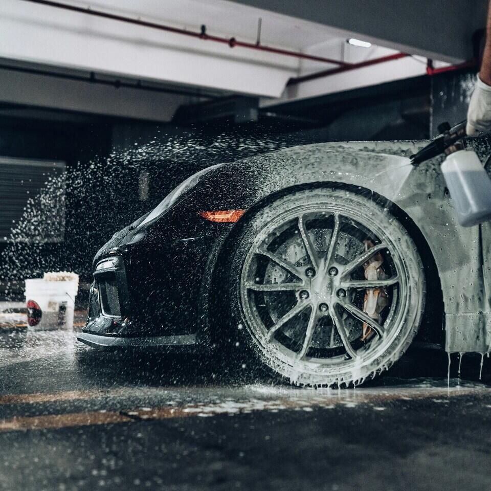 Mobile car detailing in Birmingham – black sports car being professionally cleaned